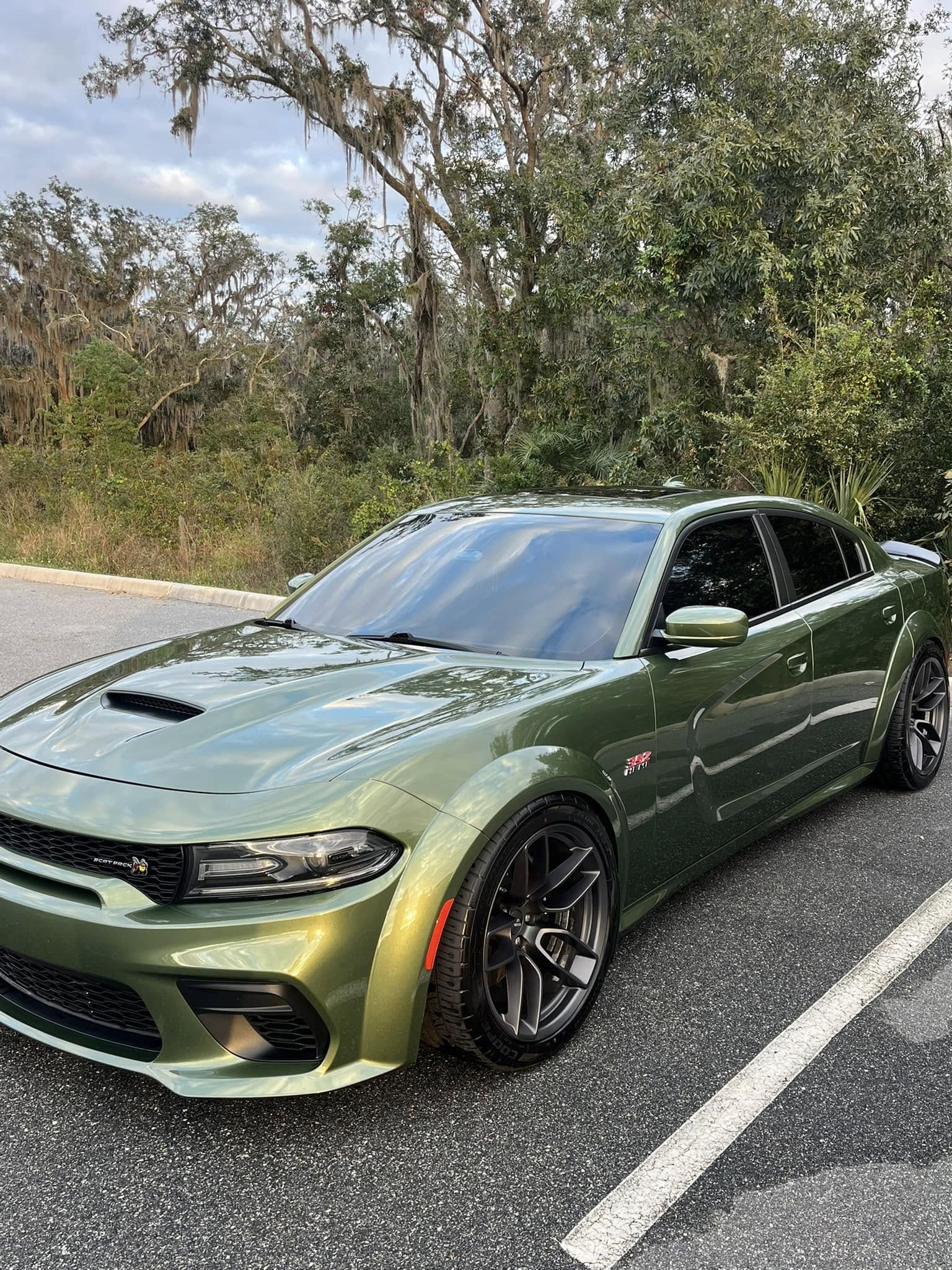 Green Dodge Charger Scat Pack with deep gloss ceramic coating in Lake County, FL