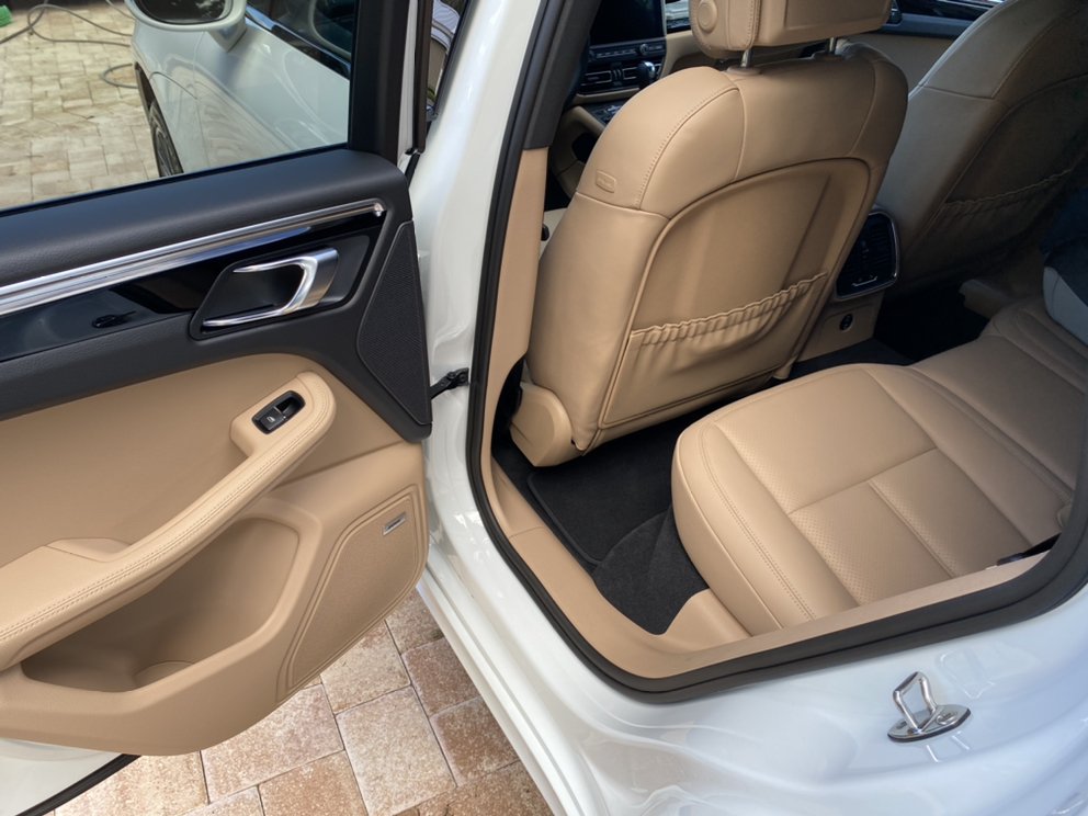 Spotless beige leather interior of a Porsche Macan after mobile interior detailing